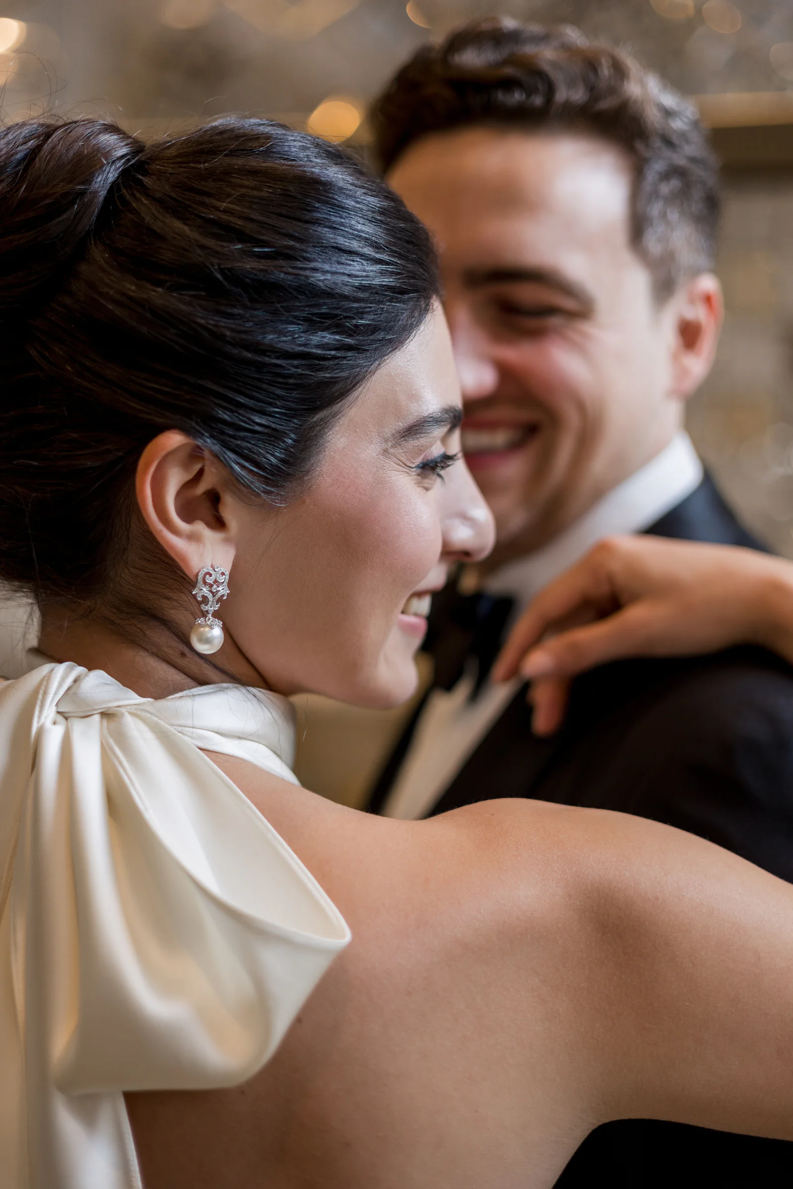 Bride and groom embracing in an elegant interior